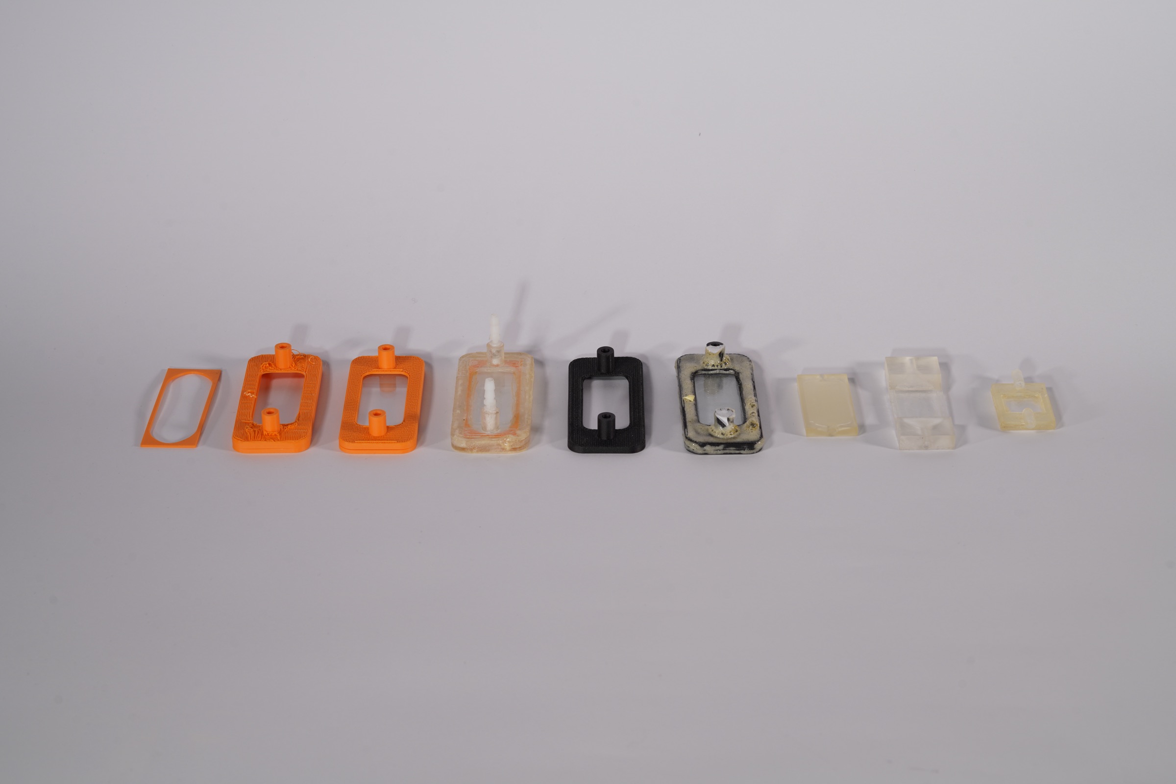 Collection of failed attempts on making a flow cell + a single functioning flow cell.